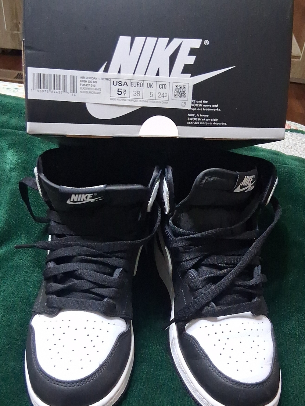 Nike Black and White High-Top Sneakers.